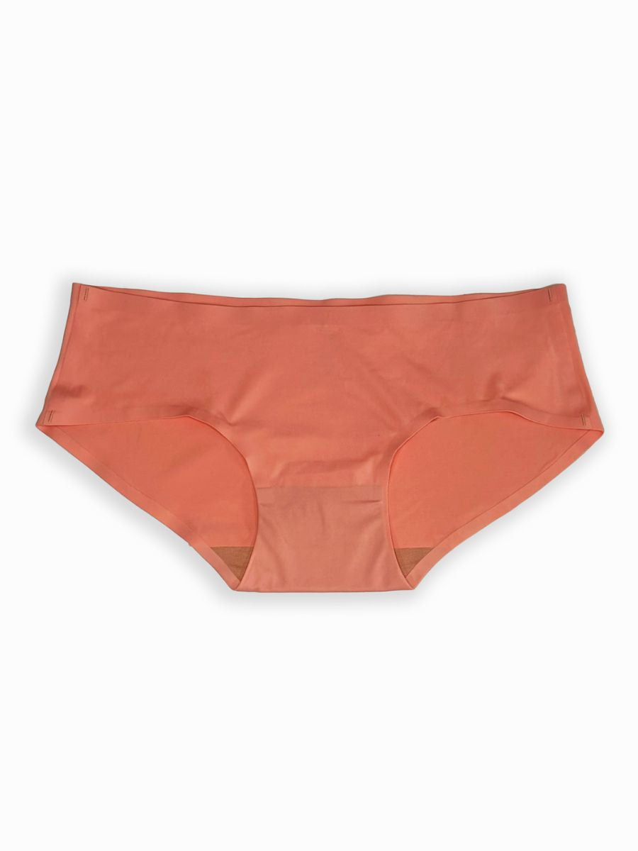 Orange women’s underwear on a white background