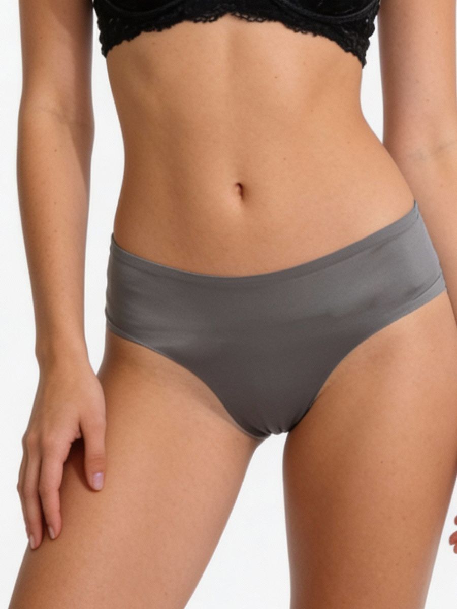 Person wearing gray underwear on a plain background